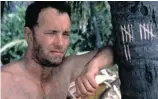  ??  ?? Chuck (Tom Hanks) becomes isolated on a remote
island after his plane crashes in Cast Away.