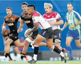  ?? Picture: ALEJANDRO PAGNI/AFP ?? IN CONTROL: Lions flyhalf Elton Jantjies, centre, controls the ball during their Super Rugby match against Argentina’s Jaguares at the Jose Amalfitani Stadium in Buenos Aires on Saturday