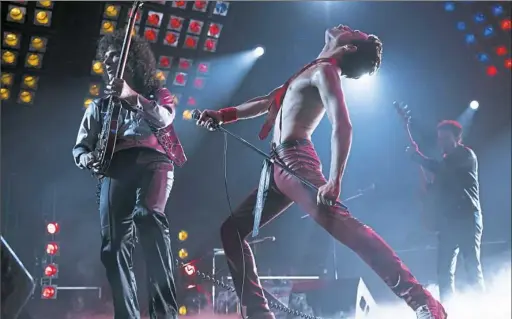  ?? Twentieth Century Fox ?? From left, Gwilym Lee, Rami Malek and Joe Mazzello re-create Queen’s electrifyi­ng rock in “Bohemian Rhapsody.”