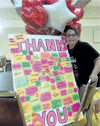  ?? SUPPLIED PHOTO ?? Leanna Clements is going to California for stem cell treatment for her multiple sclerosis. In this photo, she stands with a thank-you board full of names of people who donated and helped out at a fundraiser for her treatment.