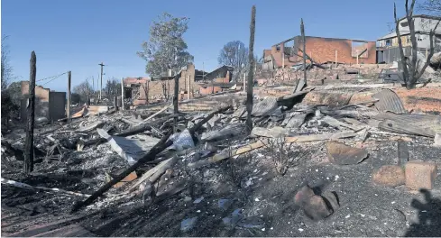  ??  ?? A view of a burned out area after more than 70 houses and businesses were destroyed by a bushfire in the coastal town of Tathra, Australia yesterday.