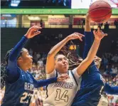  ?? ADOLPHE PIERRE-LOUIS/JOURNAL ?? La Cueva’s Jordyn Dyer, left, and Alexis Ayers, right, battle for a rebound with Hobbs’ Bhret Clay during their 5A girls state tournament semifinal Thursday at the Pit.