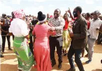  ?? ?? Harare South Member of Parliament Cde Tongai Mnangagwa (centre) and some ZANU PF supporters dance during the Emergency Road Rehabilita­tion Programme launch in Stoneridge yesterday