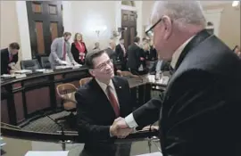  ?? Gary Coronado Los Angeles Times ?? REP. XAVIER BECERRA greets Assemblyma­n Tom Lackey before his confirmati­on hearing. He was recommende­d for state attorney general on a 6-3 vote.