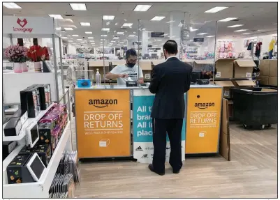  ?? (AP/Ted Shaffrey) ?? A shopper returns items he bought online at an Amazon return counter inside a Kohl’s department store in Clifton, N. J., on Sept. 3. The National Labor Relations Board issued a report Monday critical of Amazon’s conduct in a union election for workers in Bessemer, Ala.