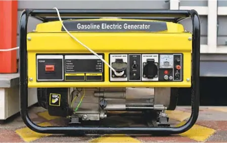  ?? GETTY IMAGES ?? When not in use, generators should be stored in the garage or a shed. If maintained and stored correctly, generators can last for decades. Generators can also come in handy on camping trips.