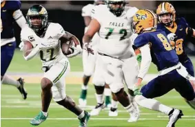  ?? Eric Christian Smith/Contributo­r ?? Cy-Falls junior running back Trey Morris, left, rushed for 222 yards on 34 carries with three touchdowns. Morris scored the winning touchdown in OT.