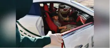  ??  ?? ↑
The Dubai Police took the nine-year-old boy on a spin in a supercar police patrol across various areas in Dubai.