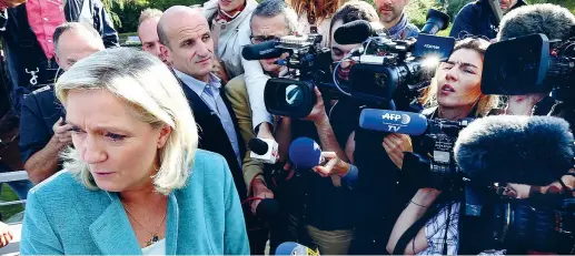  ??  ?? Prima della bufera La leader del Front National, Marine le Pen, 47 anni, domenica al lancio della campagna per le elezioni regionali (Afp)