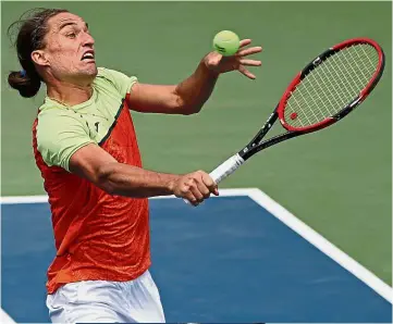  ??  ?? No worries: Alexandr Dolgopolov of Ukraine hitting a volley against Viktor Troicki of Serbia in the third round on Saturday. Inset: Italy’s Fabio Fognini has been kicked out of the competitio­n for his tirade at a female umpire. — Agencies