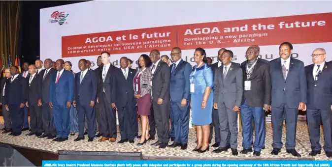  ?? — AFP ?? ABIDJAN: Ivory Coast’s President Alassane Ouattara (tenth left) poses with delegates and participan­ts for a group photo during the opening ceremony of the 18th African Growth and Opportunit­y Act (AGOA) forum in Abidjan on Monday.