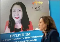  ?? ANDREW HARNIK — THE ASSOCIATED PRESS ?? Faith and Community Empowermen­t President, CEO, and Founder Hyepin Im is displayed on a monitor behind Vice President Kamala Harris as she speaks during a virtual meeting with community leaders to discuss COVID-19 public education efforts in the South Court Auditorium in the Eisenhower Executive Office Building on the White House Campus, Thursday, April 1, 2021, in Washington.