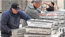  ?? ROBYN BECK/ AFP VIA GETTY IMAGES ?? Election workers process vote-by-mail ballots in Industry, Calif., on Nov. 4, 2022.