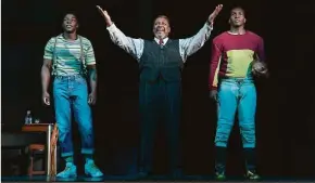  ?? Joan Marcus / Associated Press ?? From left, McKinley Belcher, Wendell Pierce and Khris Davis during a performanc­e of Arthur Miller’s “Death of a Salesman” in New York.