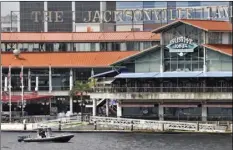  ?? THE FLORIDA TIMES-UNION VIA AP ?? Law enforcemen­t boats patrol the St. Johns River at the scene of a multiple shooting at the Jacksonvil­le Landing on Sunday, in Jacksonvil­le, Fla. WILL DICKEY/