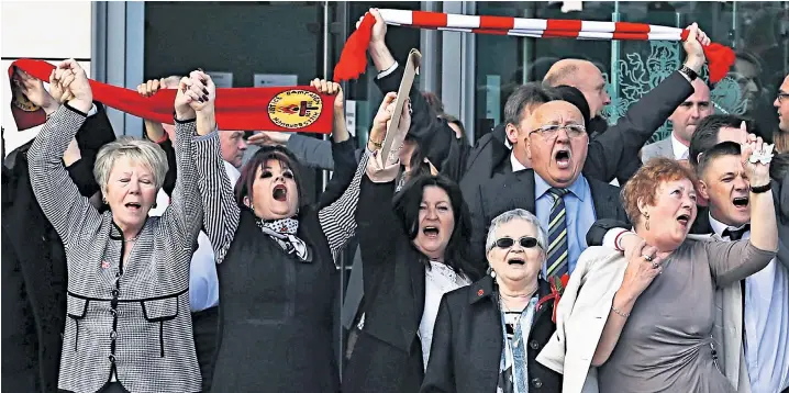  ??  ?? Families and friends of the 96 Liverpool supporters who died in the Hillsborou­gh disaster sing You’ll Never Walk Alone outside the inquest in Warrington yesterday after the jury delivered its verdict of unlawful killings. Relations have fought a 27-year battle for justice