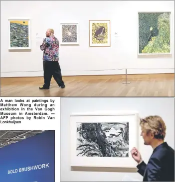  ?? AFP photos by Robin Van Lonkhuijse­n ?? A man looks at paintings by Matthew Wong during an exhibition in the Van Gogh Museum in Amsterdam.
Aman walk�� pa��t an ‘untitled’ paintin�� b�� Won�� durin�� an exhibition in the Van Go��h Mu��eum in Am��terdam.