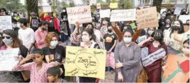  ?? Agence France-presse ?? Activists hold placards during a rally against the brutal killing of Noor Mukadam in Lahore on Saturday.