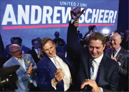  ?? FRANK GUNN, THE CANADIAN PRESS FILE PHOTO ?? Andrew Scheer, right, is congratula­ted by Maxime Bernier after being elected the new leader of the federal Conservati­ve party last month.