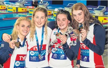  ?? Picture: SNS Group. ?? Eleanor Faulkner, Kathryn Greenslade, Holly Hibbott and Freya Anderson celebrate their victory in the women’s 4x200m freestyle event.