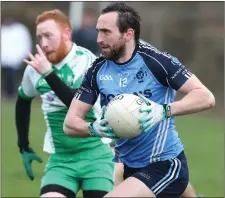  ??  ?? Paul McCabe of Bective keeps pace with Colmcille’s Graham Reilly.