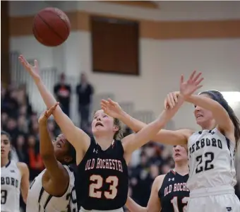  ?? JIM MAHONEY PHOTOS / BOSTON HERALD ?? ‘STRONG DEFENSE’: Foxboro’s Jordyn Collins and Abby Hassman battle for a ball with Old Rochester’s Mary Butler, center, on Monday night.