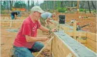  ?? NATIONAL GEOGRAPHIC VIA AP ?? Steve “Woody” Culleton rebuilds his home in Paradise, Calif., in a scene from “Rebuilding Paradise, ” a new documentar­y by director Ron Howard.