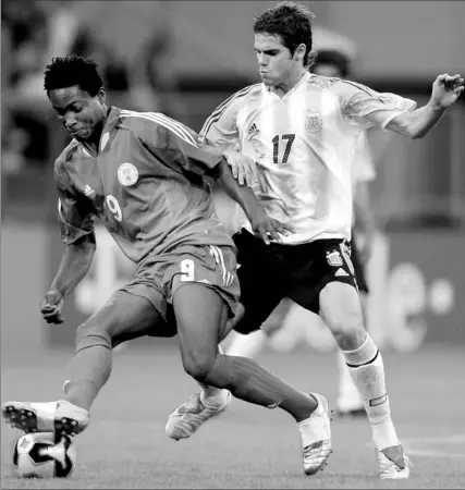  ?? LARS BARON / GETTY IMAGES ?? Nigerian-born John-Obi Mikel, left, signed with Manchester United in April but now claims he was pressured to sign with the team.