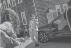  ?? DAVID GOLDMAN/AP FILE ?? Scout, a transgende­r man who uses one name, talks to neighbors June 8 outside his home in Providence, R.I.