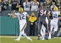  ??  ?? Green Bay Packers’ Aaron Rodgers threw four touchdown passes during Thursday’s game against the Chicago Bears in Green Bay, Wis.