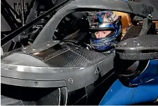  ??  ?? New Zealand’s IndyCar champion Scott Dixon testing the new cockpit safety measures on a simulator in Indianapol­is.