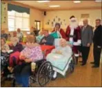  ??  ?? Santa Claus and Delaware County Council Chairman Mario Civera Jr. helped to spread some holiday cheer to the residents of Fair Acres on Dec. 16.