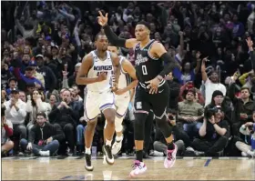  ?? AP PHOTO/MARK J. TERRILL ?? Los Angeles Clippers guard Russell Westbrook, right, celebrates after scoring as Sacramento Kings forward Harrison Barnes runs behind during the second half of an NBA basketball game Friday, Feb. 24, 2023, in Los Angeles.