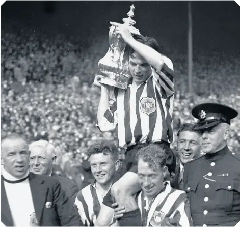  ?? ?? Raich Carter gets carried around Wembley with the FA Cup after Sunderland’s first ever triumph in the famous competitio­n.