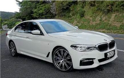  ??  ?? New 5-series is elegant – but can you tell it apart from the larger 7-series?