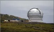  ?? CARLOS MORENO — THE ASSOCIATED PRESS FILE ?? The Gran Telescopio Canarias, one of the the world’s largest telescopes is seen at the Roque de los Muchachos Observator­y in the Canary Island of La Palma, Spain. A leading Spanish official said Monday that the consortium pushing to build a giant telescope in Hawaii amid continued protests by locals is planning to ask for a building permit for an alternativ­e site in Spain’s Canary Islands. The notificati­on comes as Native Hawaiian protesters enter the fourth week of blocking constructi­on of the telescope on a mountain they consider sacred.