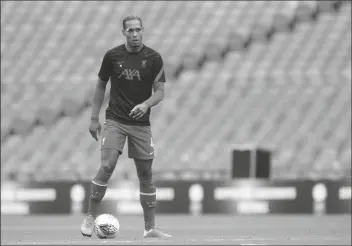  ?? ANDREW COULDRIDGE/AP ?? LIVERPOOL’S VIRGIL VAN DIJK warms up before their English FA Community Shield soccer match against Arsenal at Wembley stadium in London on Saturday.