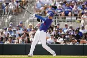  ?? ASHLEY LANDIS / ASSOCIATED PRESS ?? Los Angeles Dodgers designated hitter Shohei Ohtani hits during the third inning of a spring training baseball game against the Chicago White Sox in Phoenix on Tuesday.