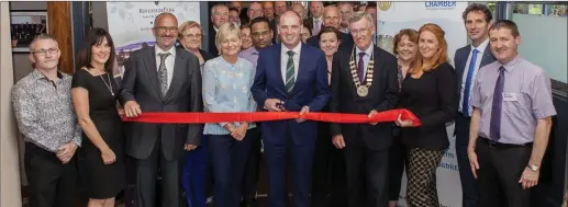  ??  ?? Paul Kehoe TD cuts the ribbon to officially open the newly refurbishe­d Promenade Bar at the Riverside Park Hotel along with Colm Neville, proprietor, Riverside Park Hotel; John Burke O’Leary, president, Enniscorth­y Chamber of Commerce and chamber...