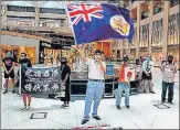  ?? AFP ?? A protester waves a British colonial flag during a ‘Lunch With You’ rally at a shopping mall in Hong Kong on Monday.