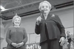  ?? AP/JACQUELYN MARTIN ?? Bernie Sanders speaks at a campaign stop Saturday at the Franklin Pierce University Fieldhouse in Rindge, N.H. Former Secretary of State Madeleine Albright introduces Hillary Clinton to the crowd Saturday at Rundlett Middle School in Concord, N.H.