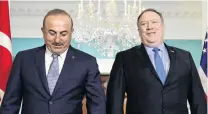  ?? PHOTO: REUTERS ?? Diplomatic postures . . . Turkey’s Foreign Minister Mevlut Cavusoglu (left) and US Secretary of State Mike Pompeo face reporters before their meeting yesterday.