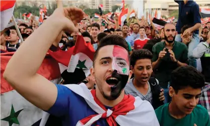  ?? Photograph: Louai Beshara/AFP/Getty Images ?? The World Cup qualifier against Australia gave Syrians a chance to unite behind their national team.