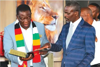  ?? ?? President Mnangagwa goes through a Bible he was gifted by Solusi University Vice Chancellor Professor Khumbulani Mpofu, who was part of the Seventh Day Adventist delegation that toured the President’s Precabe Farm in Kwekwe yesterday. (More pictures on Page 2)