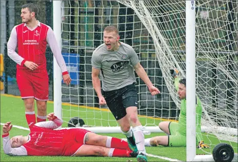  ?? Match report and photograph­s: Derek Black ?? A jubilant Dene Cassells put Saints 2-1 in front.