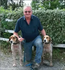  ??  ?? Joseph Driscoll from the Portmagee Club with his senior hound Blue Tornado and maiden hound Darling winners of the 2018 Associatio­n Drag Hunt at Cahersivee­n, Joseph record now shows he has the Associatio­n Drag Hunt won 5 times this is a record for...