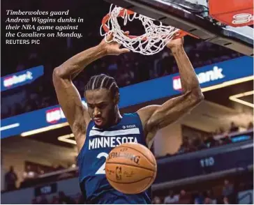  ?? REUTERS PIC ?? Timberwolv­es guard Andrew Wiggins dunks in their NBA game against the Cavaliers on Monday.