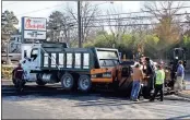  ??  ?? The rain finally stopped Tuesday to allow crews to pave the parking lot of the new Truett’s Chick-fil-A on Shorter Avenue in time for the Thursday morning grand opening. / Doug Walker