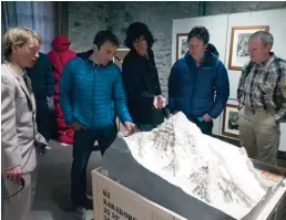  ??  ?? Left: Simon Anthamatte­n, Ueli Steck, Hansjörg Auer, Ian Welsted and John Roskelley around a scale model of K2