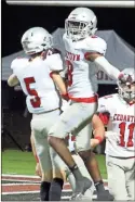  ?? Jeremy Stewart ?? Cedartown’s Donald Knight celebrates with quarterbac­k Reece Tanner after scoring a touchdown on a 72-yard pass during the second quarter of Friday’s game.